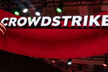 CrowdStrike’s logo seen over a red background.