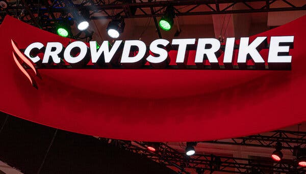 CrowdStrike’s logo seen over a red background.